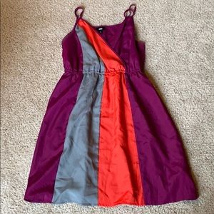 purple dress with orange and grey stripes